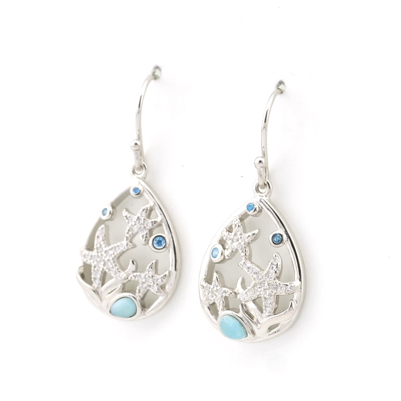Silver teardrop earrings with starfish designs on a white background