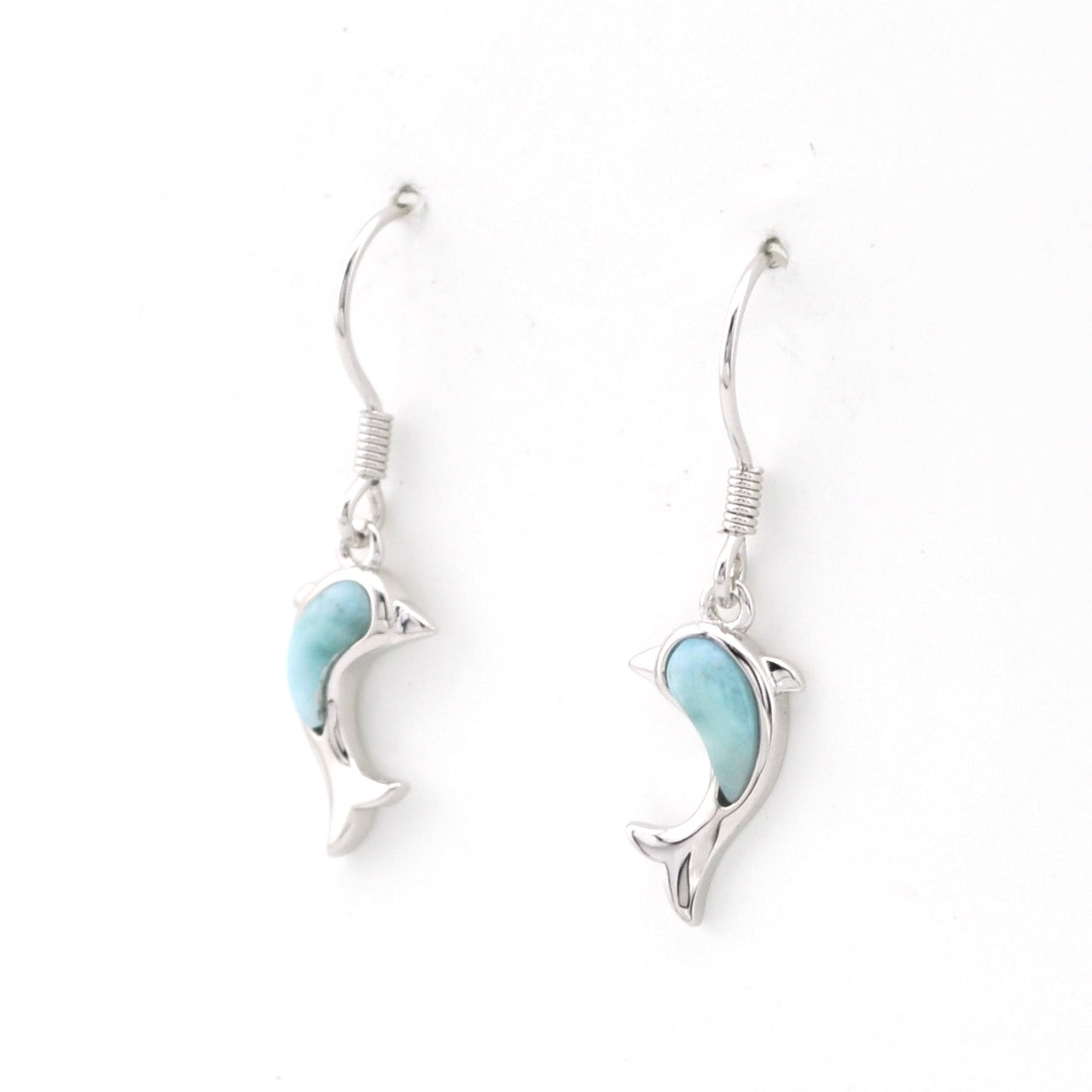 Silver dolphin earrings with larimar stones on a white background