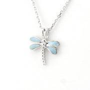 Dragonfly-shaped pendant on a chain against a white background