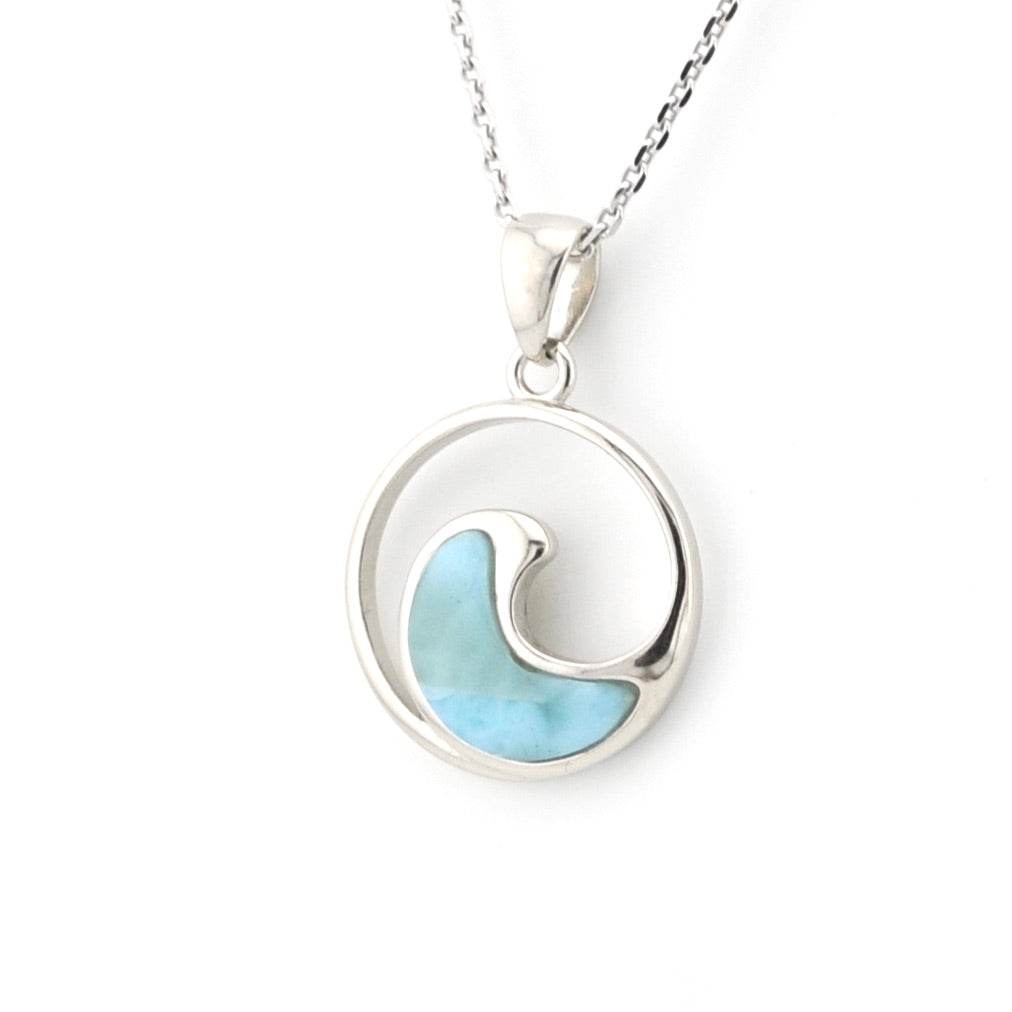 Silver necklace with a circular pendant featuring a blue wave design on a white background
