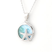 Silver necklace with a starfish pendant on a white background