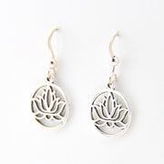Silver lotus flower earrings on a white background