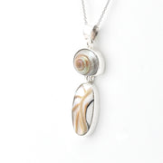 Necklace with a shell pendant on a white background