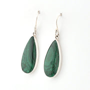 Teardrop-shaped green earrings with silver hooks on a white background