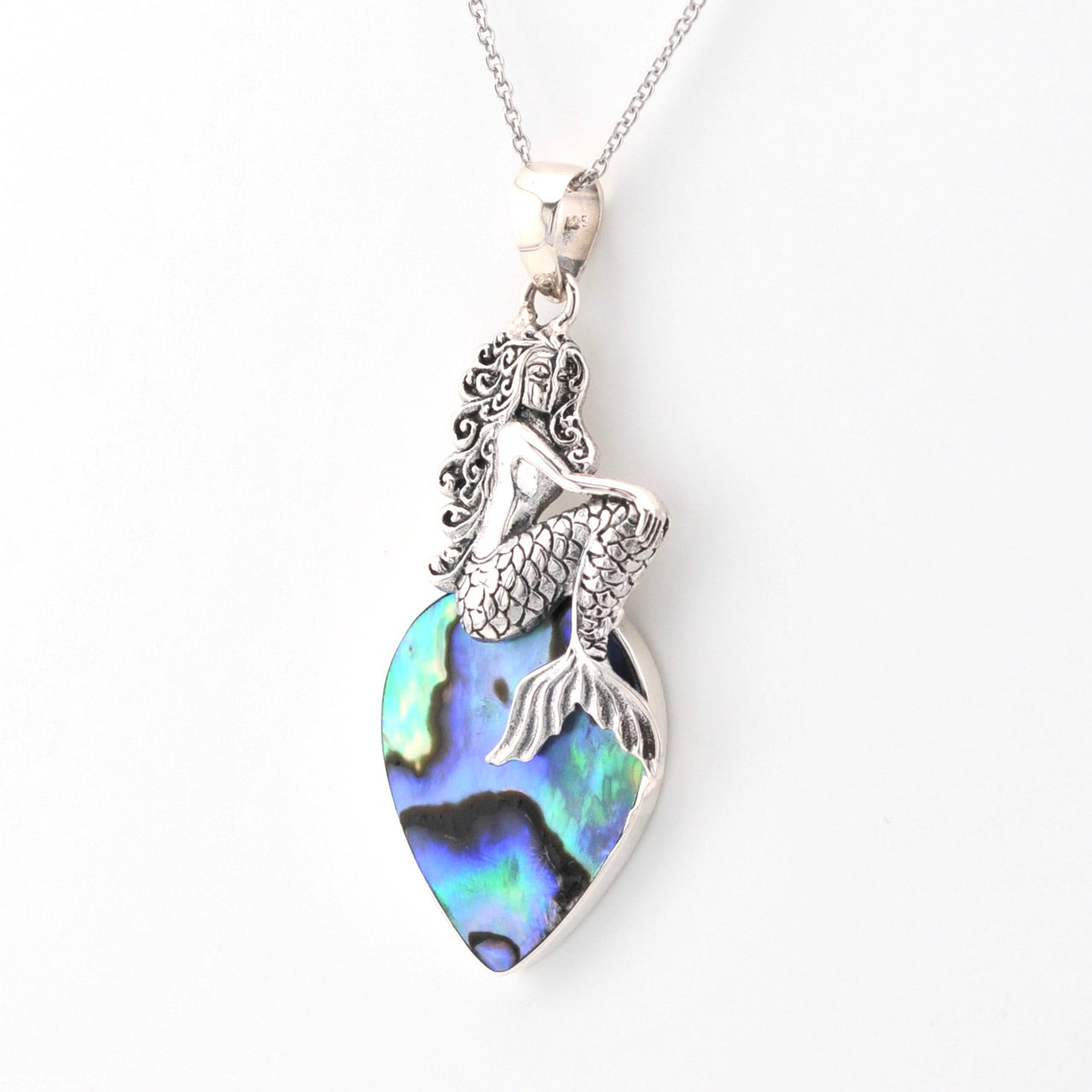 Mermaid pendant with abalone shell on a white background