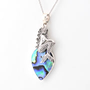 Mermaid pendant with abalone shell on a white background
