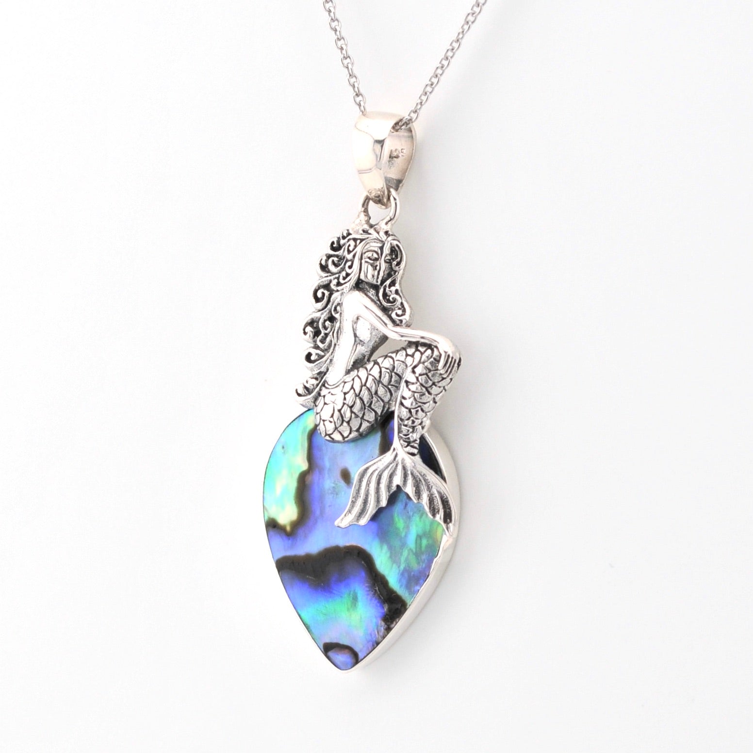 Mermaid pendant with abalone shell on a white background