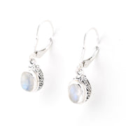 Silver earrings with moonstone stones on a white background