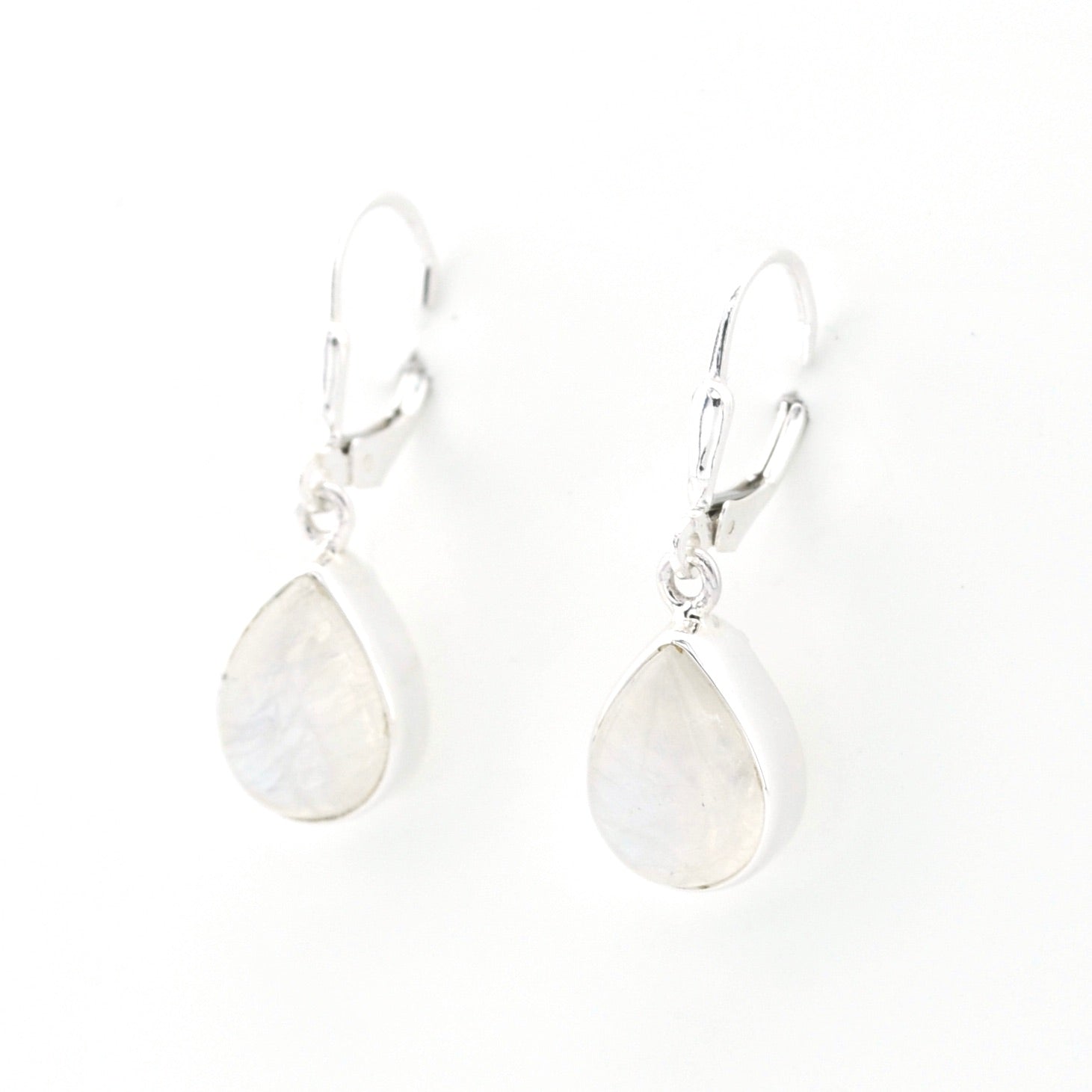 Silver teardrop earrings on a white background