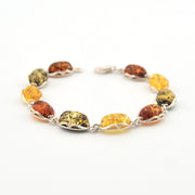 Multicolored amber bracelet on a white background
