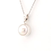 Pearl necklace with a silver clasp on a white background