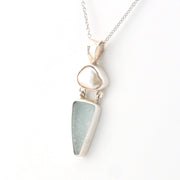 Silver necklace with a pendant on a white background