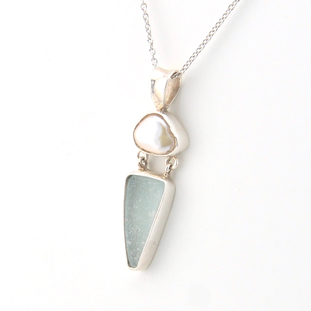 Silver necklace with a pendant on a white background