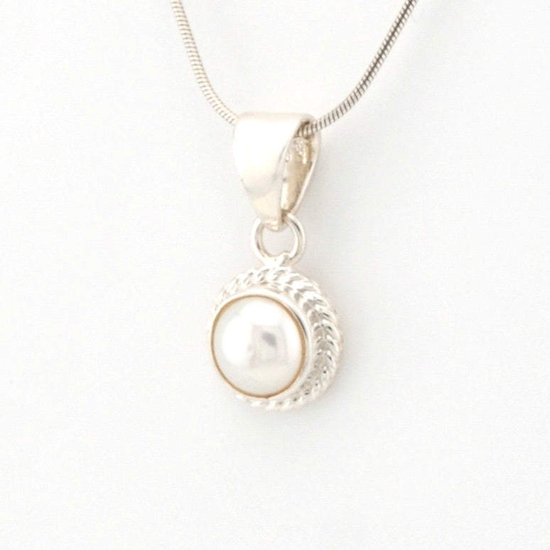 Pearl pendant necklace on a white background