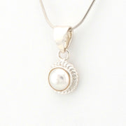 Pearl pendant necklace on a white background