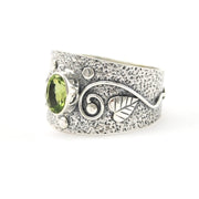 Side View Silver Peridot 5x7mm Oval Leaf Swirl Ring