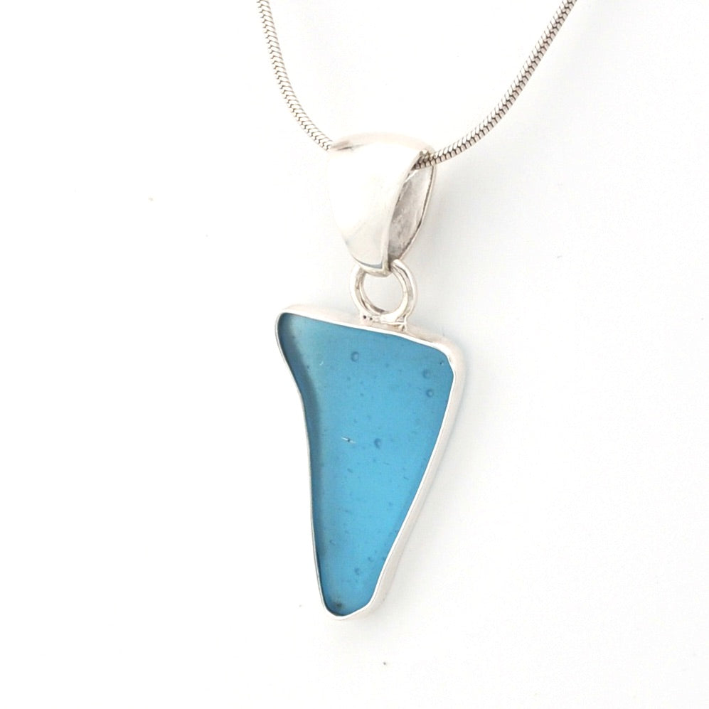 Blue pendant necklace on a white background