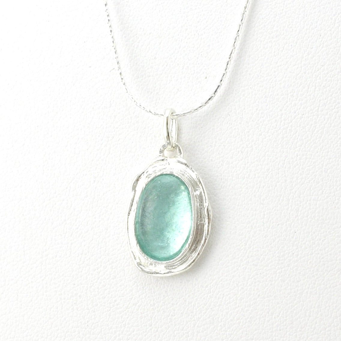 Side View Silver Roman Glass Oval Necklace