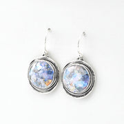 Silver earrings with round Roman glass on a white background
