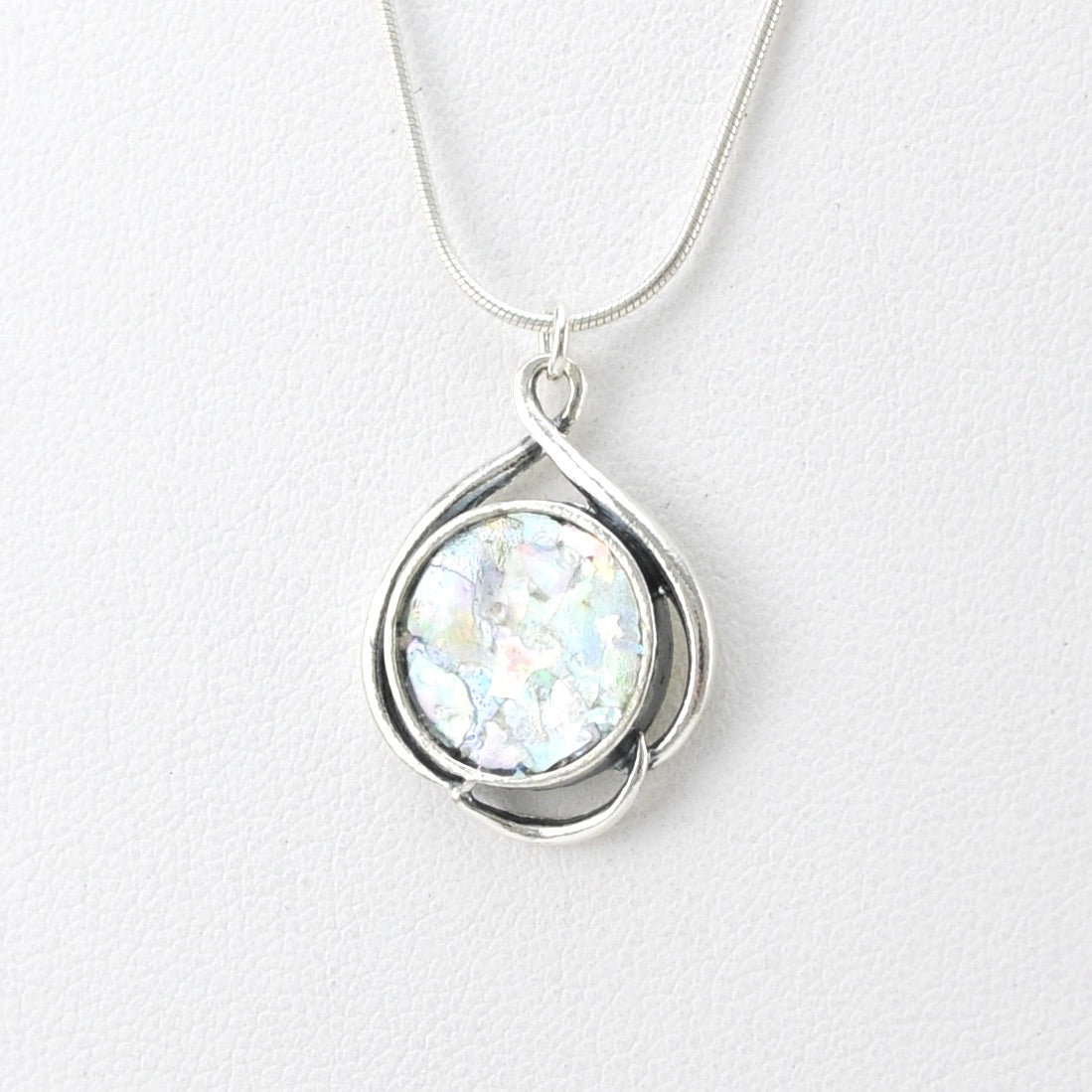 Side View Silver Roman Glass Swirl Circle Necklace