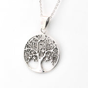 Silver tree of life pendant on a white background