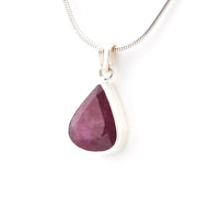 Teardrop-shaped purple gemstone pendant on a white background