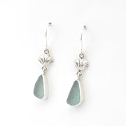 Pair of silver earrings with teardrop-shaped gray stones on a white background