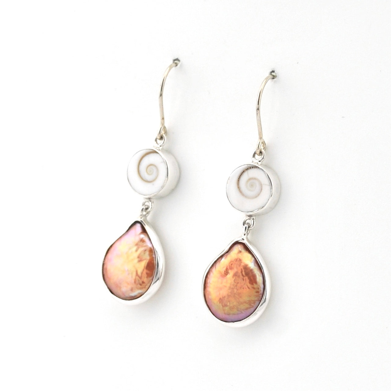 Pair of earrings with teardrop-shaped pink stones on a white background
