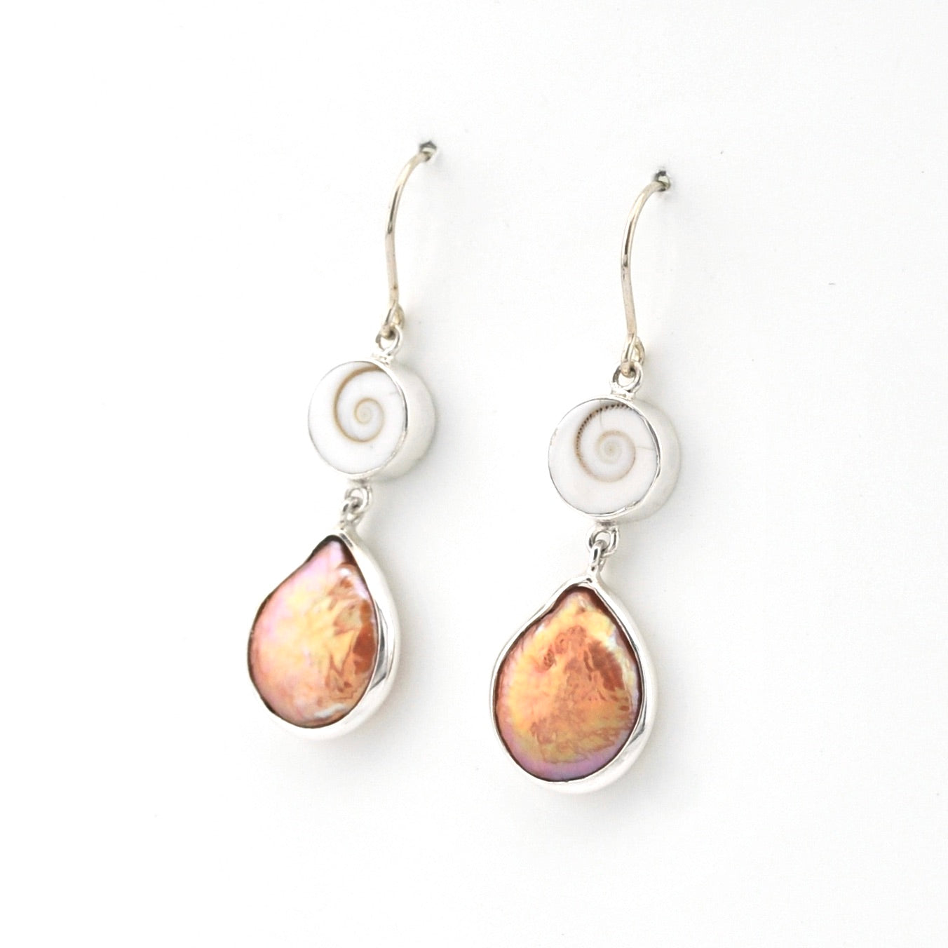 Pair of earrings with teardrop-shaped pink stones on a white background