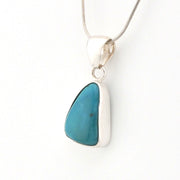Necklace with a blue pendant on a white background