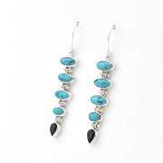 Handmade sterling silver dangle earrings featuring genuine turquoise and green quartz gemstones.