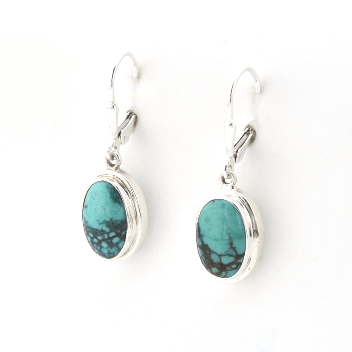 Silver Turquoise Oval Dangle Earrings on white background