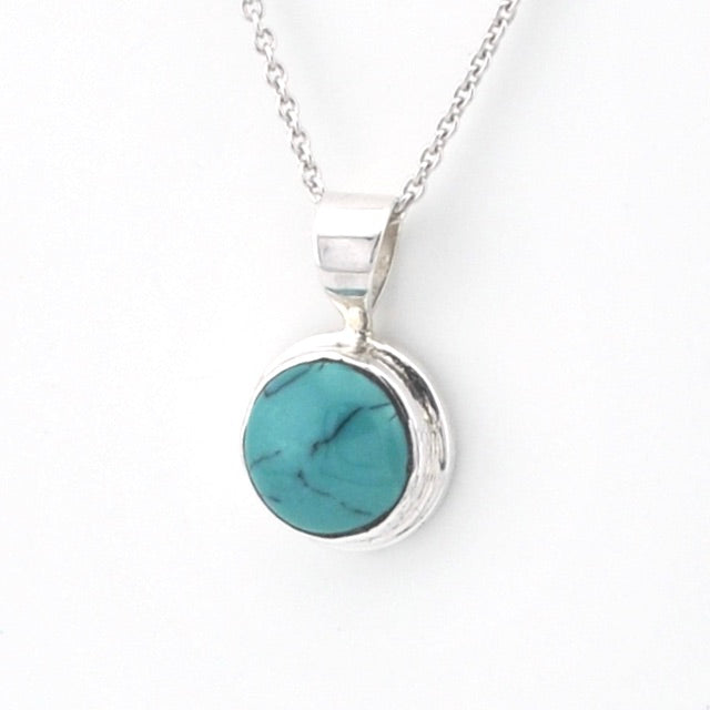 Turquoise pendant necklace on a white background