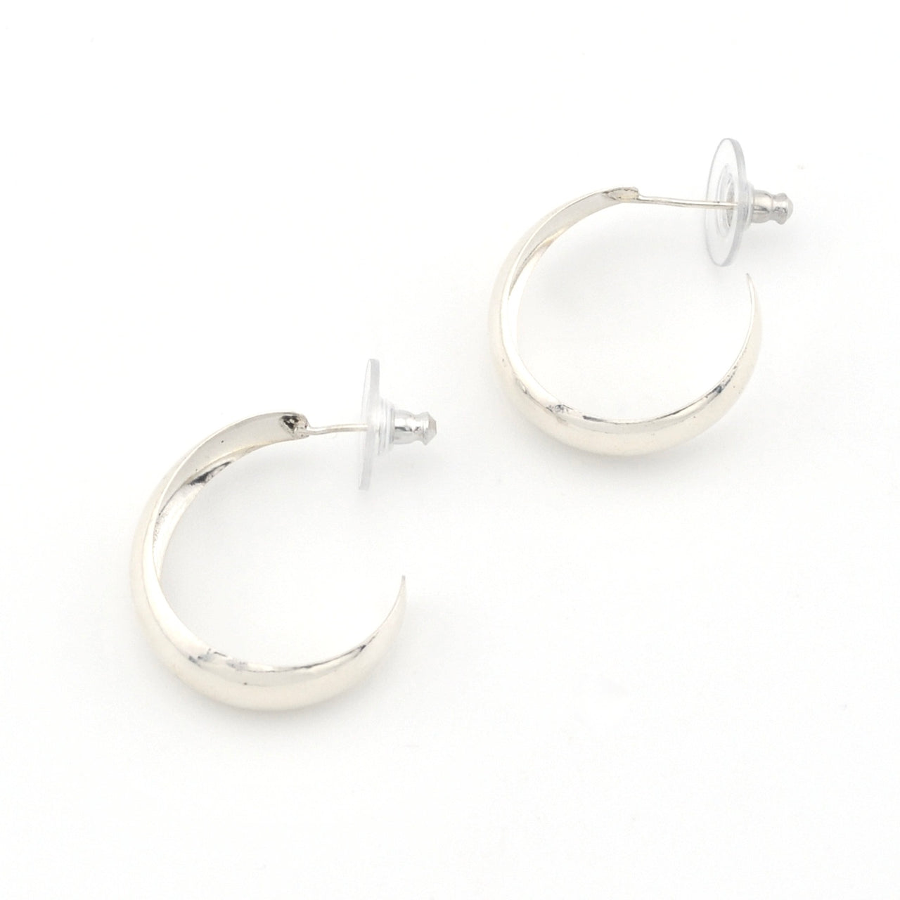 Silver hoop earrings on a white background