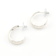 Silver hoop earrings on a white background