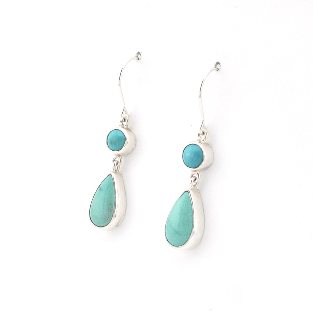 Turquoise teardrop earrings on a white background