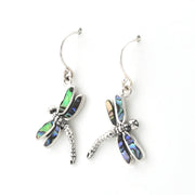 A pair of silver dragonfly drop earrings with iridescent abalone shell wings, displayed on a clean white background.