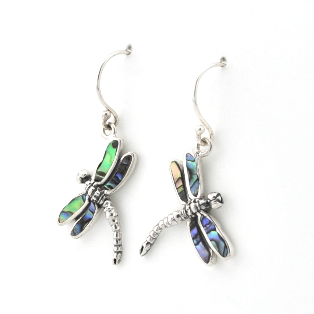 A pair of silver dragonfly drop earrings with iridescent abalone shell wings, displayed on a clean white background.