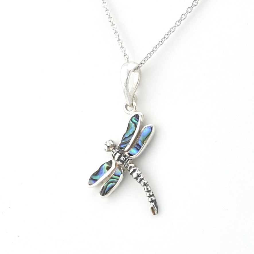 Silver dragonfly pendant with inlaid abalone on silver chain.