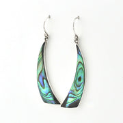 A pair of silver-toned dangle earrings with teardrop-shaped abalone shell inlays showing iridescent green, blue, and black patterns, set against a plain white background.