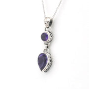 Sterling Silver Amethyst Round Pear Bali Necklace on a white background.