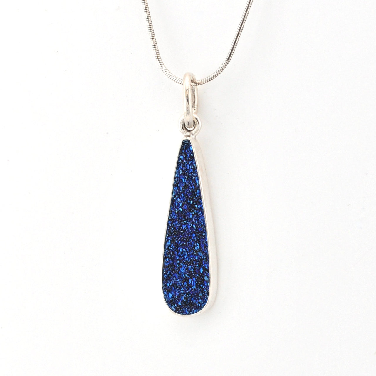 Teardrop-shaped blue pendant on a white background