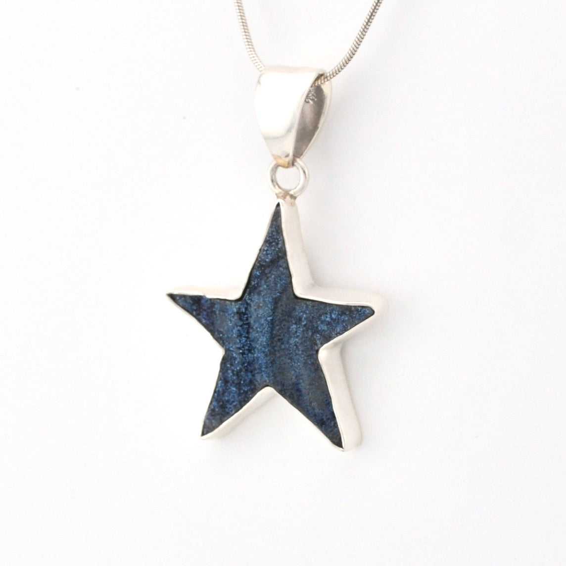 Star-shaped pendant on a white background