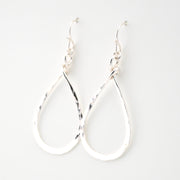 Silver hoop earrings on a white background