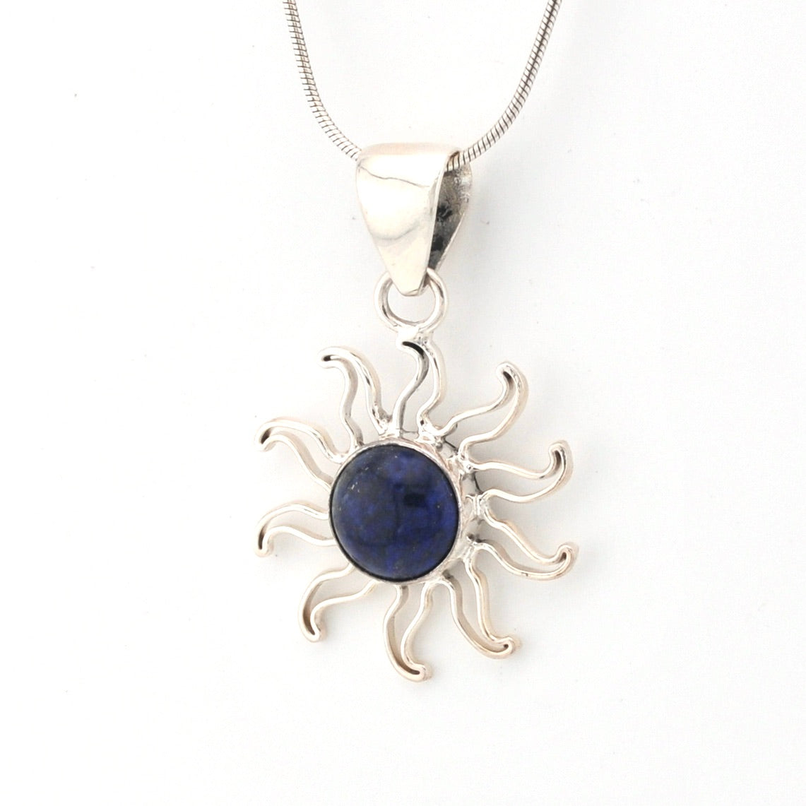 Silver sun-shaped pendant with a blue stone on a white background