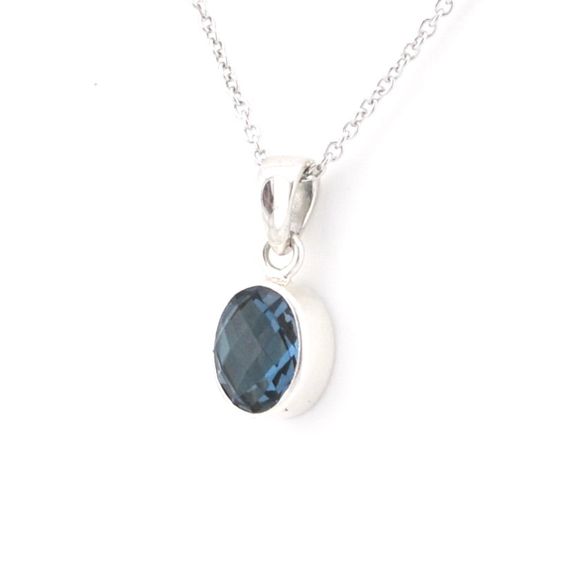 Silver chain with dark blue pendant on a white background