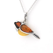 A silver bird pendant necklace featuring amber-colored stones, shown on a clean white background.