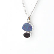 Necklace with a pendant featuring two stones on a white background