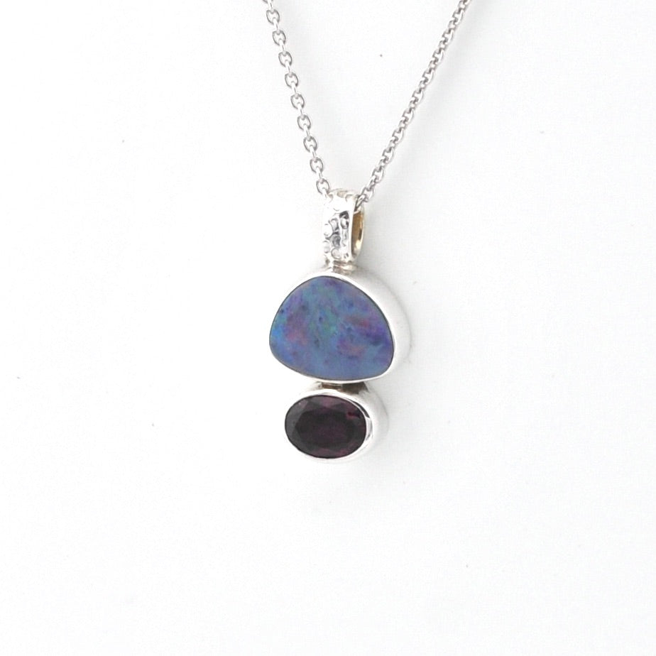 Necklace with a pendant featuring two stones on a white background