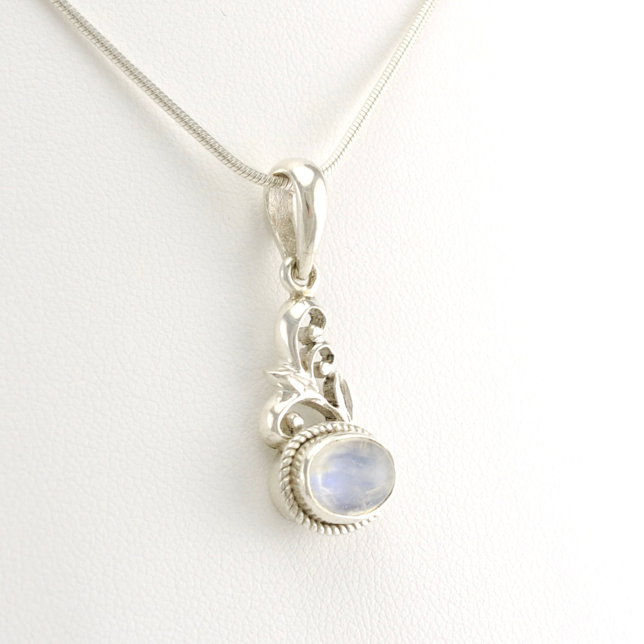 Side View Sterling Silver Oval Rainbow Moonstone Scroll Pendant